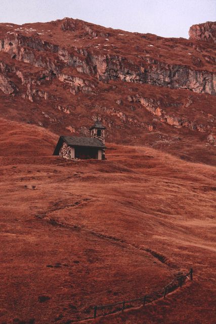 Solitary Chapel in Rugged Mountainous Landscape at Dusk - Download Free Stock Images Pikwizard.com