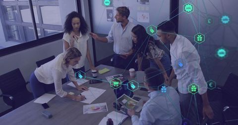 Diverse team collaborating around table with digital network overlay for strategy planning