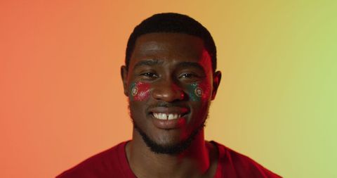 Portuguese Flag Painted Face on Supportive Male Fan Smiling