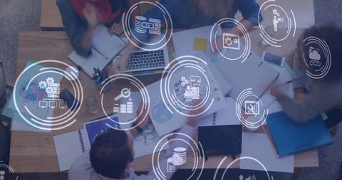 Team Collaborating with Digital Network Interface in Office