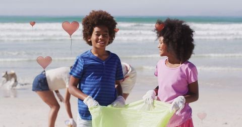 African American Children Volunteering in Beach Cleanup