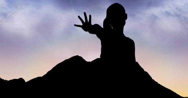 Digital composite of Silhouette girl showing palm on mountain against sky