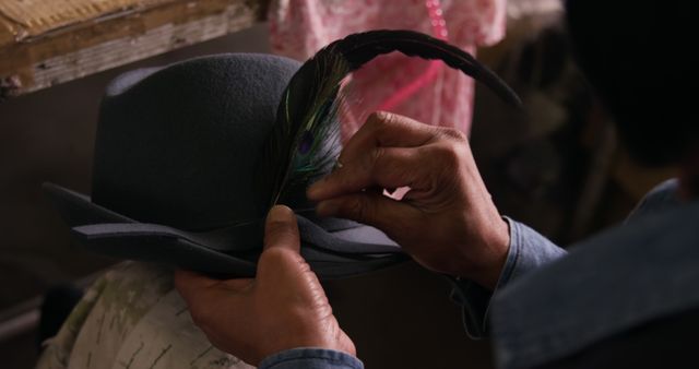 Artisan Adding Feather to Elegant Grey Hat - Download Free Stock Images Pikwizard.com