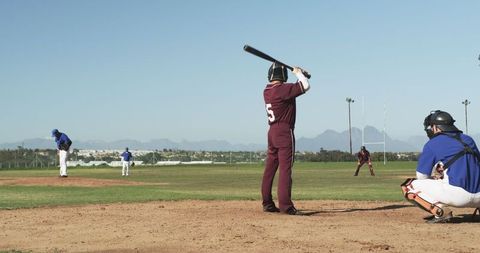 Baseball Players in Action on Scenic Field