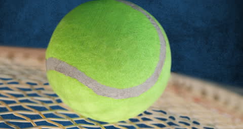 Close-Up Animation of Tennis Ball on Racket Strings