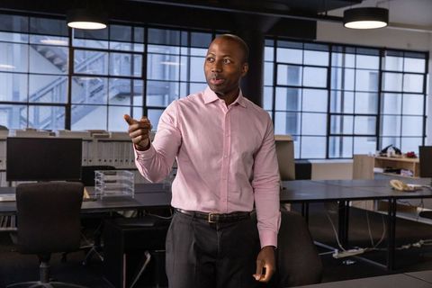 Businessman Presenting Ideas During Office Meeting