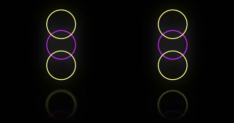 Neon yellow and pink circles on black background