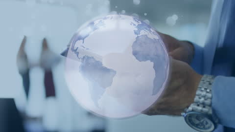 Businessman Holding Smartphone with Digital Globe Overlay