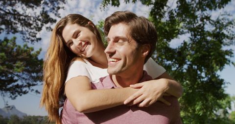 Laughing Couple in Sunny Garden Enjoying Time Together - Download Free Stock Images Pikwizard.com