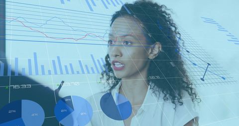 Diverse Team Collaborating with Financial Charts Overlay