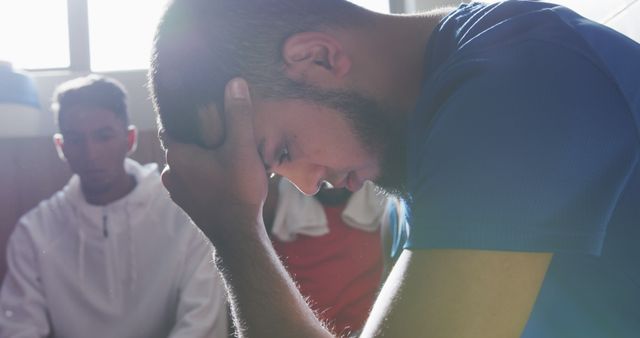 Young Man in Deep Thought in Locker Room - Download Free Stock Images Pikwizard.com