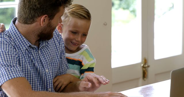 Father Bonding with Son While Working at Home on Laptop - Download Free Stock Images Pikwizard.com