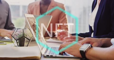 Diverse Team Working on NFT Tech in Modern Office