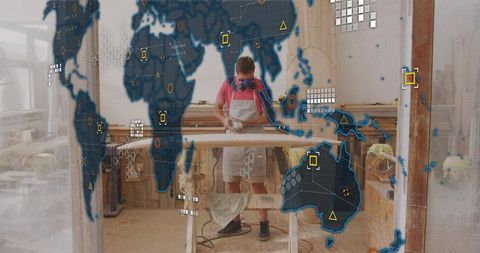 Woodworker sanding board in workshop with augmented reality hud overlay