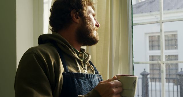 Man Drinking Coffee and Looking Out Window - Download Free Stock Images Pikwizard.com