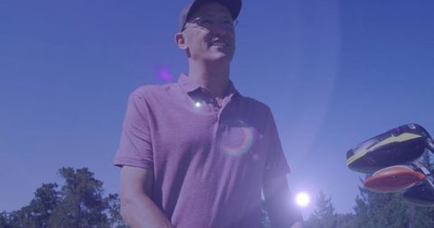 Senior Man Enjoying Golf with Sunlight and Light Trail Effects