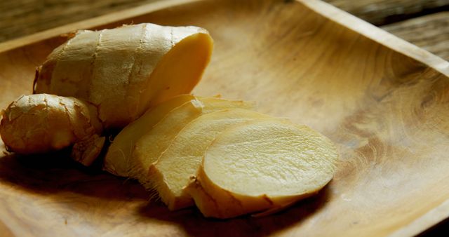 Sliced Fresh Ginger Root on Wooden Surface - Download Free Stock Images Pikwizard.com