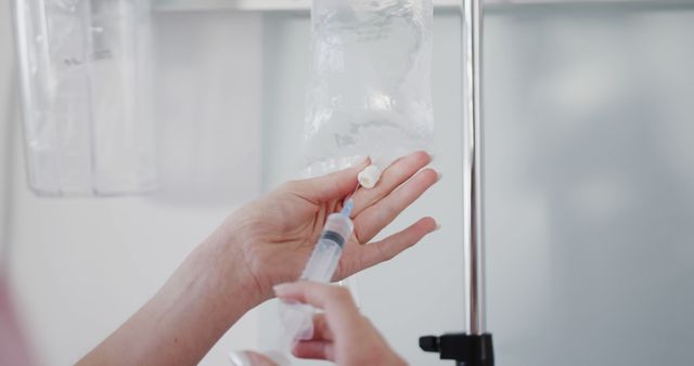 Healthcare Worker Preparing IV for Medical Treatment - Download Free Stock Images Pikwizard.com