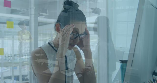 Stressed Businesswoman with Headache in Office - Download Free Stock Images Pikwizard.com