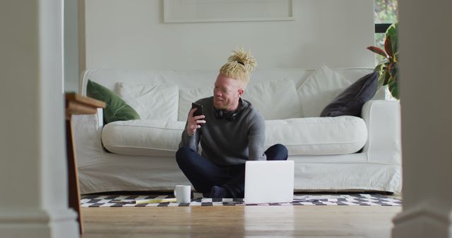 Man Sitting on Floor Working from Home with Laptop and Coffee - Download Free Stock Images Pikwizard.com