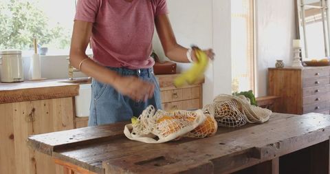 Unpacking groceries in sustainable kitchen setting