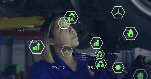 Mechanic analyzing vehicle undercarriage with tech overlays in garage