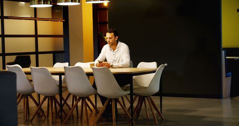Businessman Sitting Alone in Modern Office Cafeteria - Download Free Stock Images Pikwizard.com