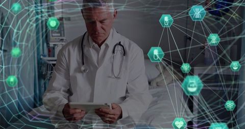 Doctor using tablet with digital medical network overlay in hospital