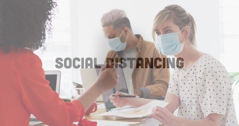 Office colleagues practicing social distancing during pandemic