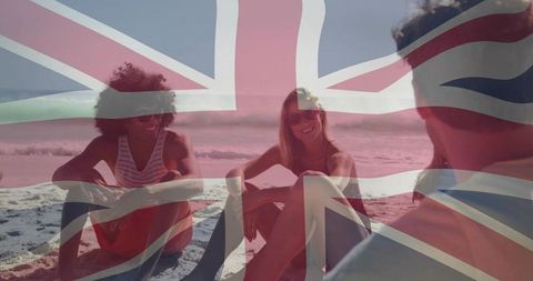 Friends socializing on union jack-tinted beach wearing swimwear, summer lifestyle