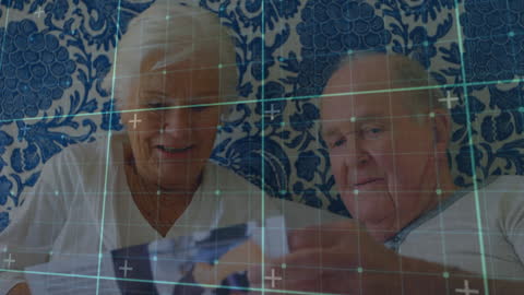 Senior Couple Surrounded by Data Overlay in Hospital Setting