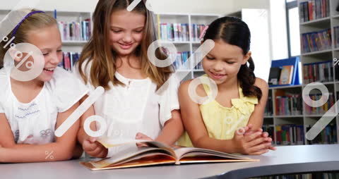 Joyful Girls Collaborating in Library with Digital Overlays