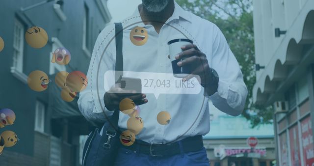 Thumbs up icon with increasing likes and face emojis against african american man drinking coffee. social media marketing and technology concept