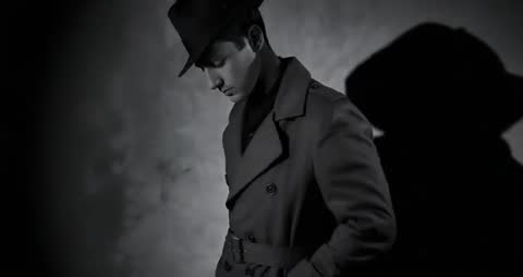 Mysterious Model Striding in Fedora Featured in Fashion Editorial