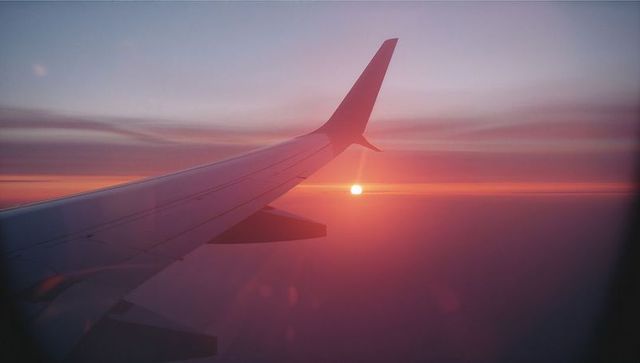 Airplane Wing Sunset Horizon View from Cabin Window