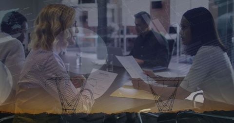 Diverse workforce discussing data and analytics in modern office