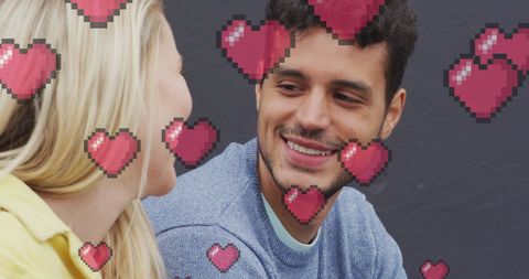 Happy couple chatting with animated hearts effects