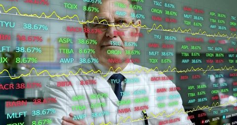 Senior financial analyst analyzing stock market trends in trading room