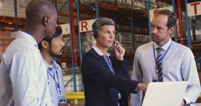 Warehouse manager leading team through logistics discussion - Download Free Stock Images Pikwizard.com