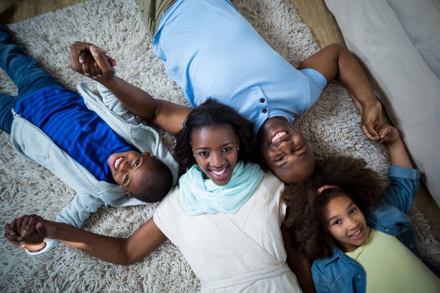 Happy Family Lying on Carpet at Home - Download Free Stock Photos Pikwizard.com