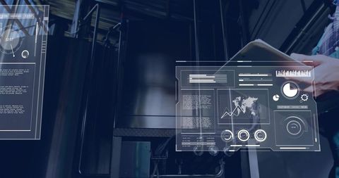 Holographic industrial dashboards overlaying data while technician holding tablet