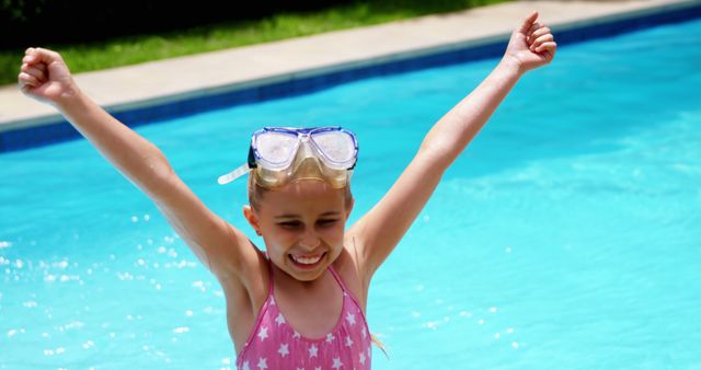 Happy girl enjoying in swimming pool