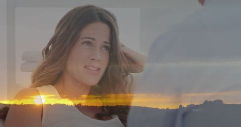 Layered image of therapist session over serene sunset landscape