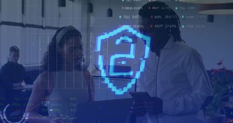 Cybersecurity Shield Symbol with Team Discussing Digital Data