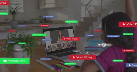 Child raising hand in virtual classroom with laptop headset and school supplies for remote learning