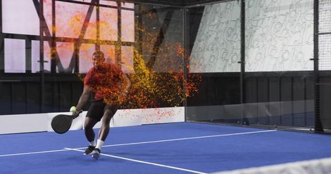 Lunging padel player creating vibrant particle energy while striking ball on blue court