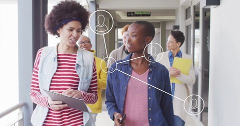 Diverse Team Collaborating in Office Hallway