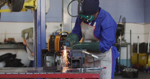 Mechanic Welding in Garage with Protective Gear - Download Free Stock Images Pikwizard.com