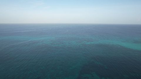 Tranquil ocean horizon with gentle waves