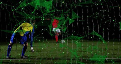 Striker shooting penalty past goalkeeper under floodlights with green digital network overlay